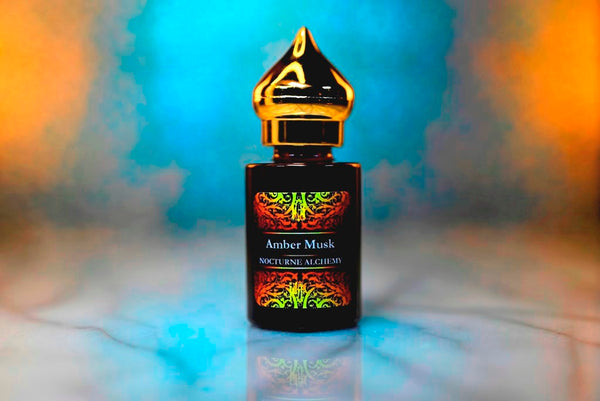 6ml amber cylindrical bottle with gold-toned domed lid and insert.  Amber Musk