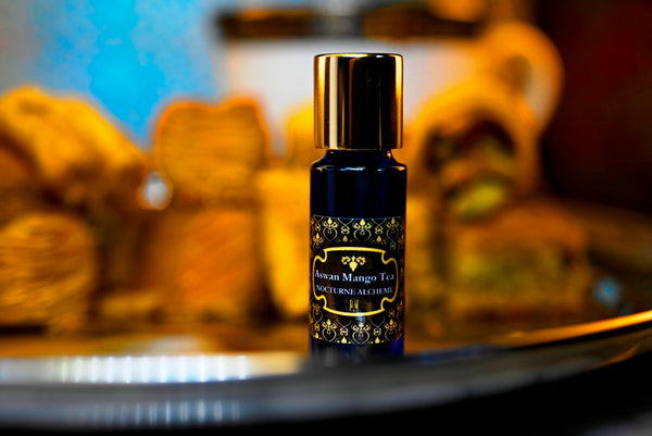 Aswan Mango Tea.  5ml Slender Blue bottle with dropper insert and gold-tone screw lid. 