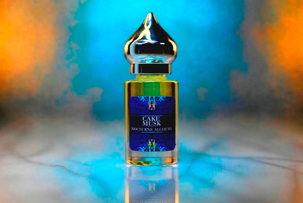 6ml clear cylindrical bottle with silver-toned domed lid and insert. Cake Musk