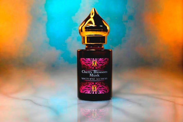 6ml amber cylindrical bottle with gold-toned domed lid and insert.  Cherry Blossom Musk