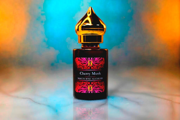 6ml amber cylindrical bottle with gold-toned domed lid and insert.  Cherry Musk