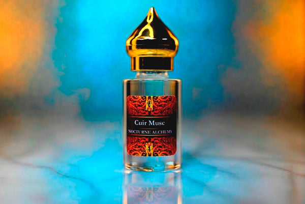 6ml Clear cylindrical bottle with gold-toned domed lid and insert.  Cuir Musk