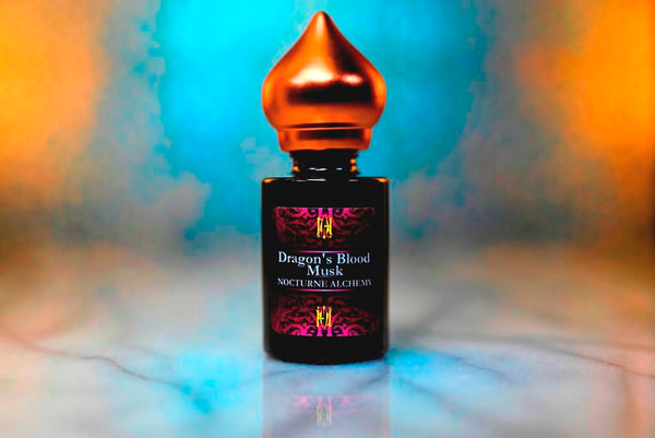 6ml amber cylindrical bottle with matte copper-toned domed lid and insert.  Dragon's Blood Musk