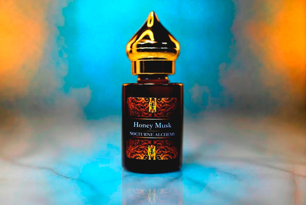 6ml amber cylindrical bottle with gold-toned domed lid and insert.  Honey Musk