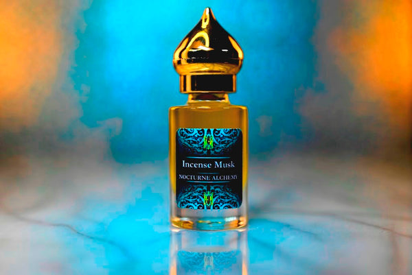 6ml clear cylindrical bottle with gold-toned domed lid and insert.  Incense Musk