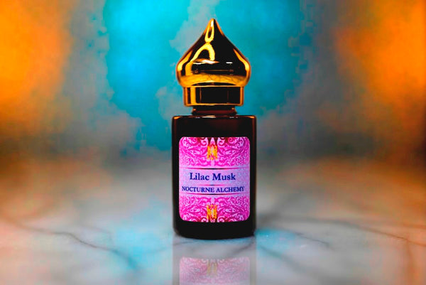 6ml amber cylindrical bottle with gold-toned domed lid and insert.  Lilac Musk