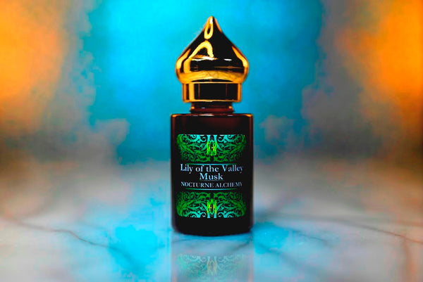 6ml amber cylindrical bottle with gold-toned domed lid and insert.  Lily of the Valley Musk