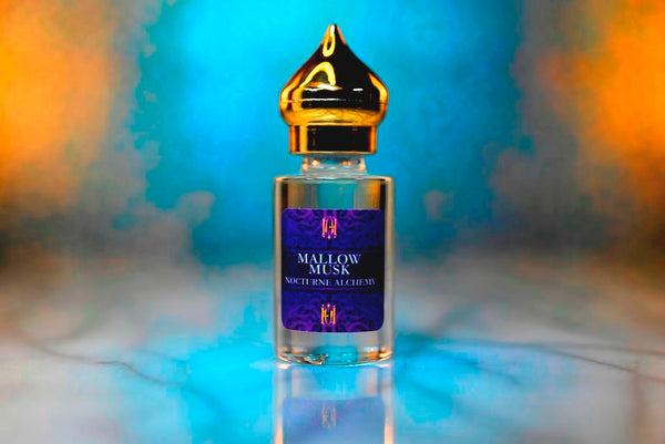 6ml clear cylindrical bottle with gold-toned domed lid and insert.  Mallow Musk