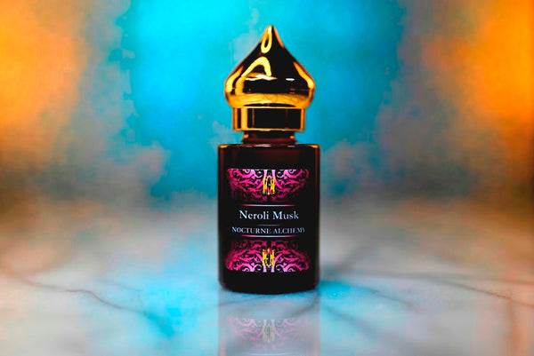 6ml amber cylindrical bottle with gold-toned domed lid and insert.  Neroli Musk