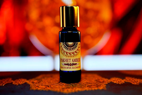 Pakhet Amber 5ml slender blue bottle with insert dropper and gold-toned screw lid