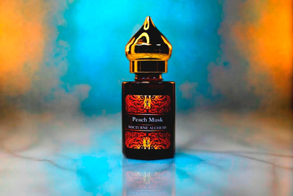 6ml amber cylindrical bottle with gold-toned domed lid and insert.  Peach Musk