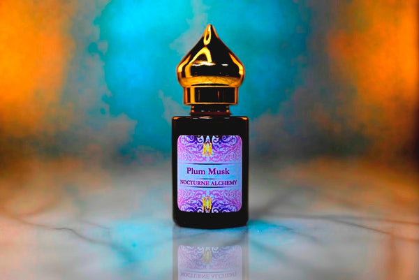 6ml amber cylindrical bottle with gold-toned domed lid and insert.  Plum Musk