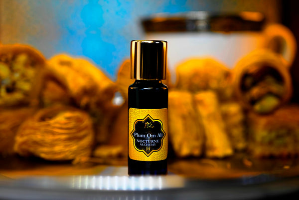 Plum Om Ali.  5ml Slender Blue bottle with dropper insert and gold-tone screw lid. 