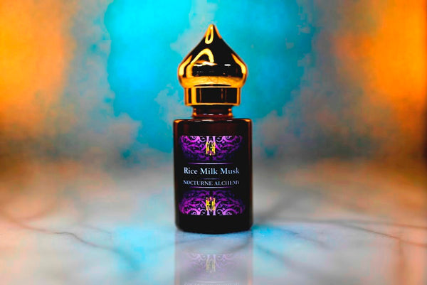 6ml amber cylindrical bottle with gold-toned domed lid and insert.  Rice Milk Musk