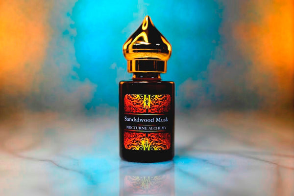 6ml amber cylindrical bottle with gold-toned domed lid and insert.   Sandalwood Musk