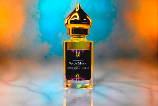 6ml clear cylindrical bottle with gold-toned domed lid and insert.  Spice Musk