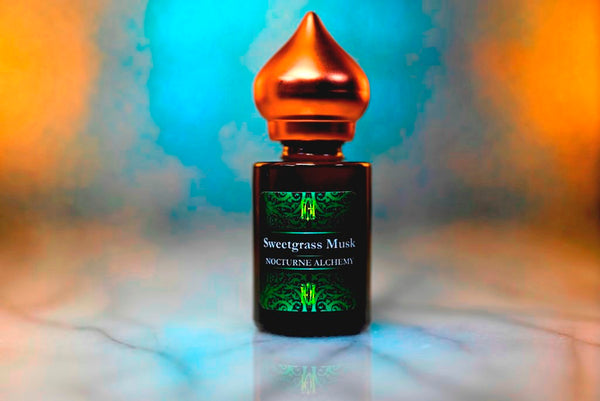 6ml amber cylindrical bottle with matte copper-toned domed lid and insert.  Sweetgrass Musk