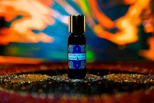 Water Re-Atum 5ml slender blue bottle with gold toned screw lid and insert dropper