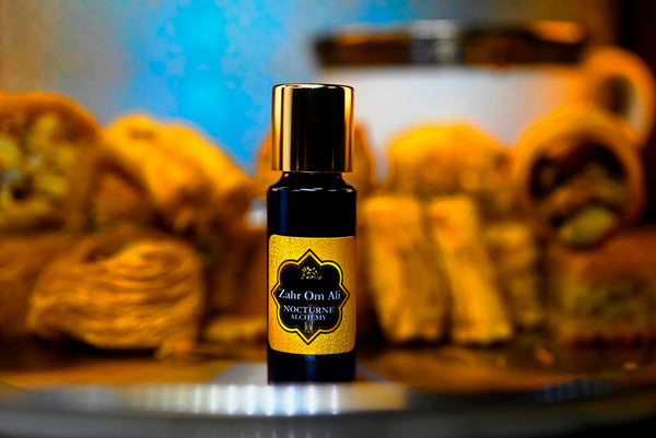 Zahr Om Ali.  5ml Slender Blue bottle with dropper insert and gold-tone screw lid. 