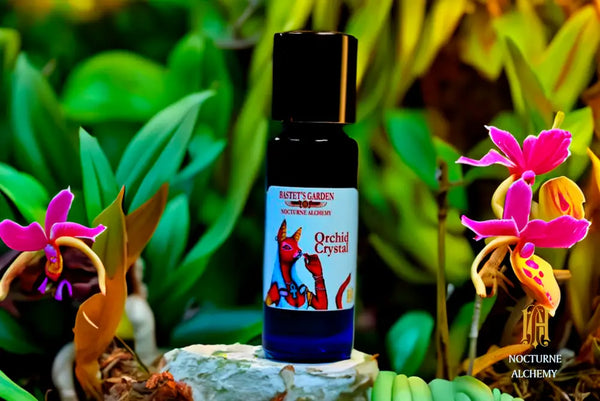 Orchid Crystal  5ml Slender Blue bottle with insert dropper and shiny gold screw lid.