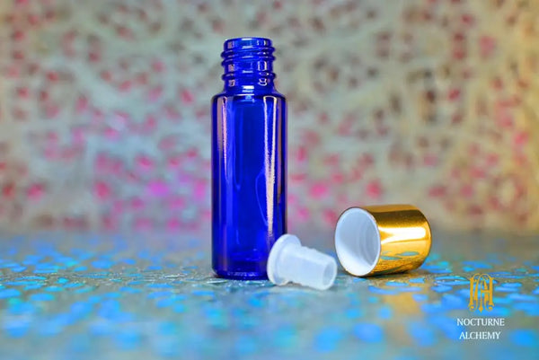 5ml slender blue bottle with insert dropper and golden metal twist lid SAMPLE