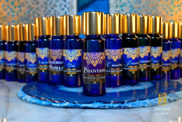 Group photo of 5ml slender blue bottles of Etherias