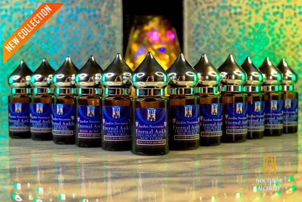 full set of all twelve Bastet's Eternal Ankh Jardin Nocturne perfumes each in 6ml amber cylindrical bottle with flat insert dropper and silver-toned twist domed lid