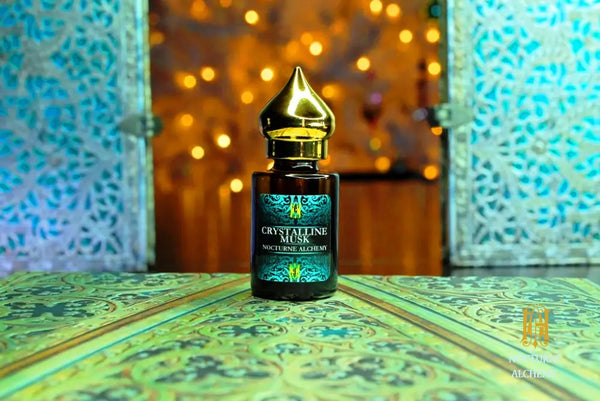 6ml amber cylindrical bottle with flat insert/dropper and golden domed twist lid.