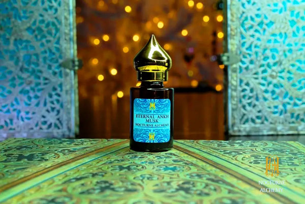 6ml amber cylindrical bottle with flat insert/dropper and golden domed twist lid.