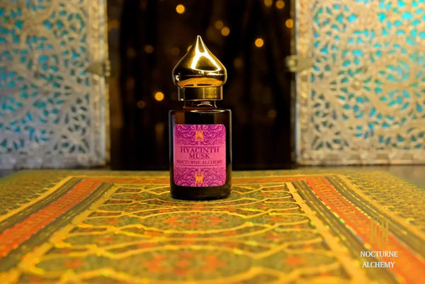 6ml amber cylindrical bottle with flat insert/dropper and golden domed twist lid.