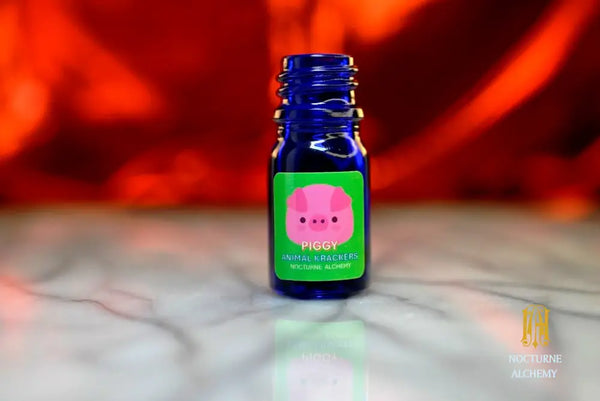 Piggy Animal Krackers - 5ml cobalt blue bottle no insert, phenolic screw lid. 