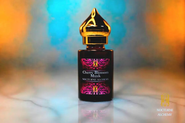 6ml amber cylindrical bottle with gold-toned domed lid and insert.  Cherry Blossom Musk
