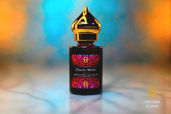 6ml amber cylindrical bottle with gold-toned domed lid and insert.  Cherry Musk
