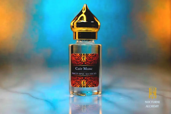 6ml Clear cylindrical bottle with gold-toned domed lid and insert.  Cuir Musk