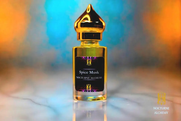 6ml clear cylindrical bottle with gold-toned domed lid and insert.  Spice Musk