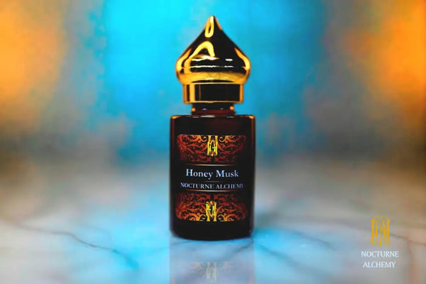 6ml amber cylindrical bottle with gold-toned domed lid and insert.  Honey Musk