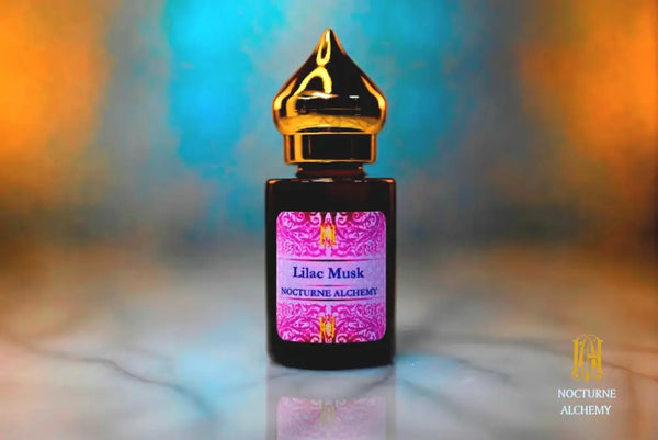 6ml amber cylindrical bottle with gold-toned domed lid and insert.  Lilac Musk