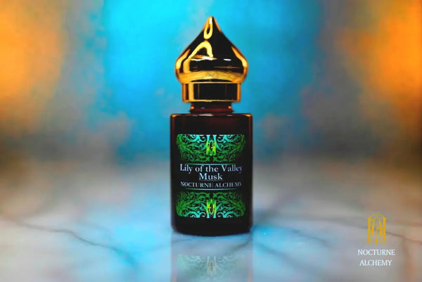 6ml amber cylindrical bottle with gold-toned domed lid and insert.  Lily of the Valley Musk