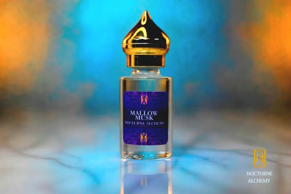 6ml clear cylindrical bottle with gold-toned domed lid and insert.  Mallow Musk