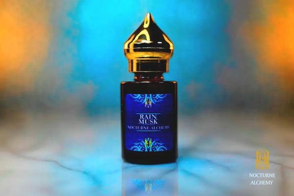 6ml amber cylindrical bottle with gold-toned domed lid and insert.  Rain Musk