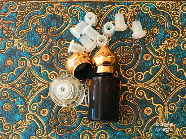 empty bottle, inserts and domed lids for example