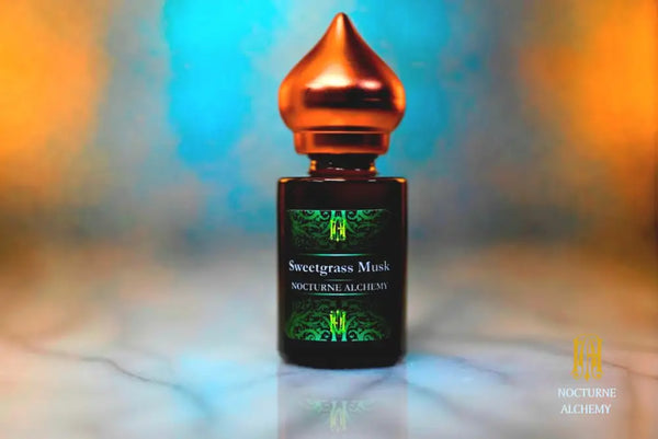 6ml amber cylindrical bottle with matte copper-toned domed lid and insert.  Sweetgrass Musk