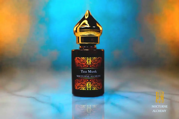 6ml amber cylindrical bottle with gold-toned domed lid and insert.  Tea Musk