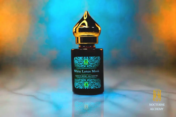6ml amber cylindrical bottle with gold-toned domed lid and insert.  White Lotus Musk