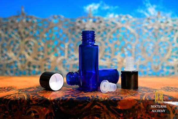 5mL slender blue bottle with dropper insert and black screw cap shown in photo